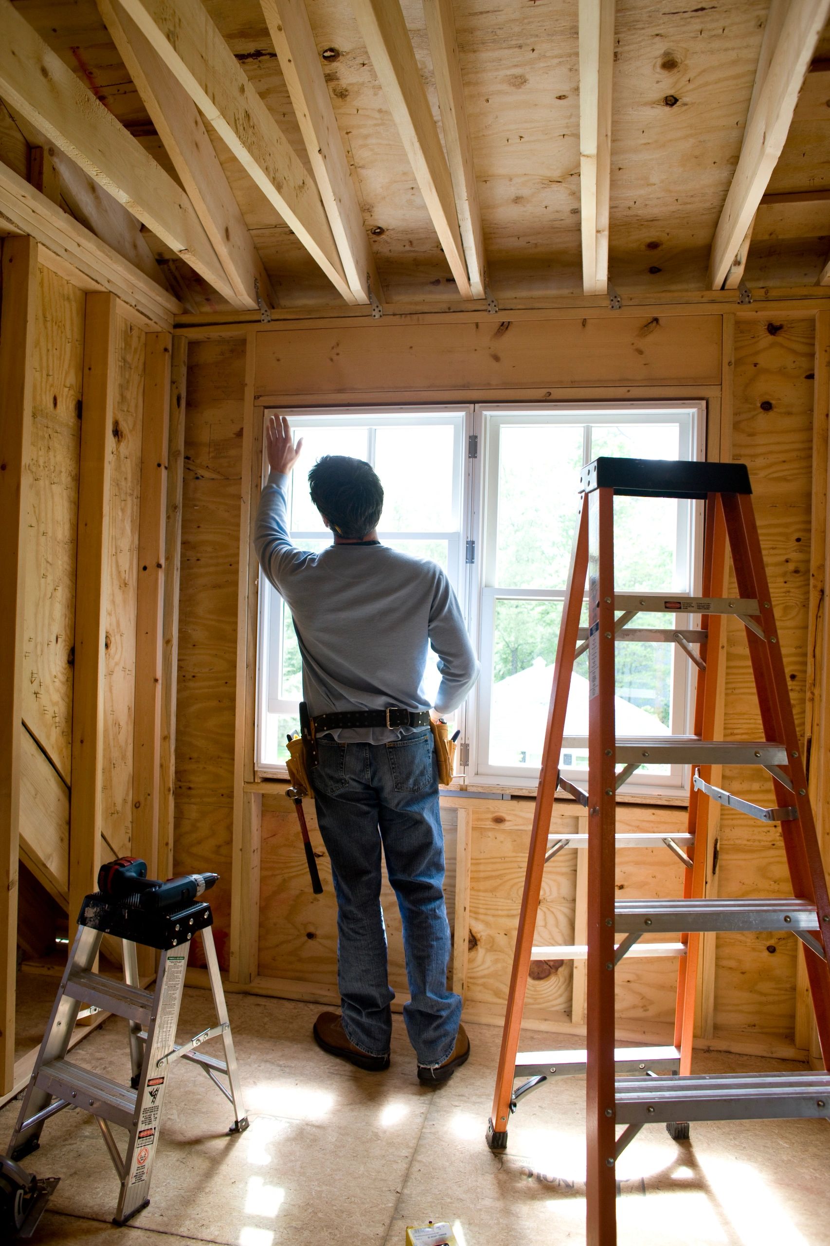 Professional handyman painting a wall